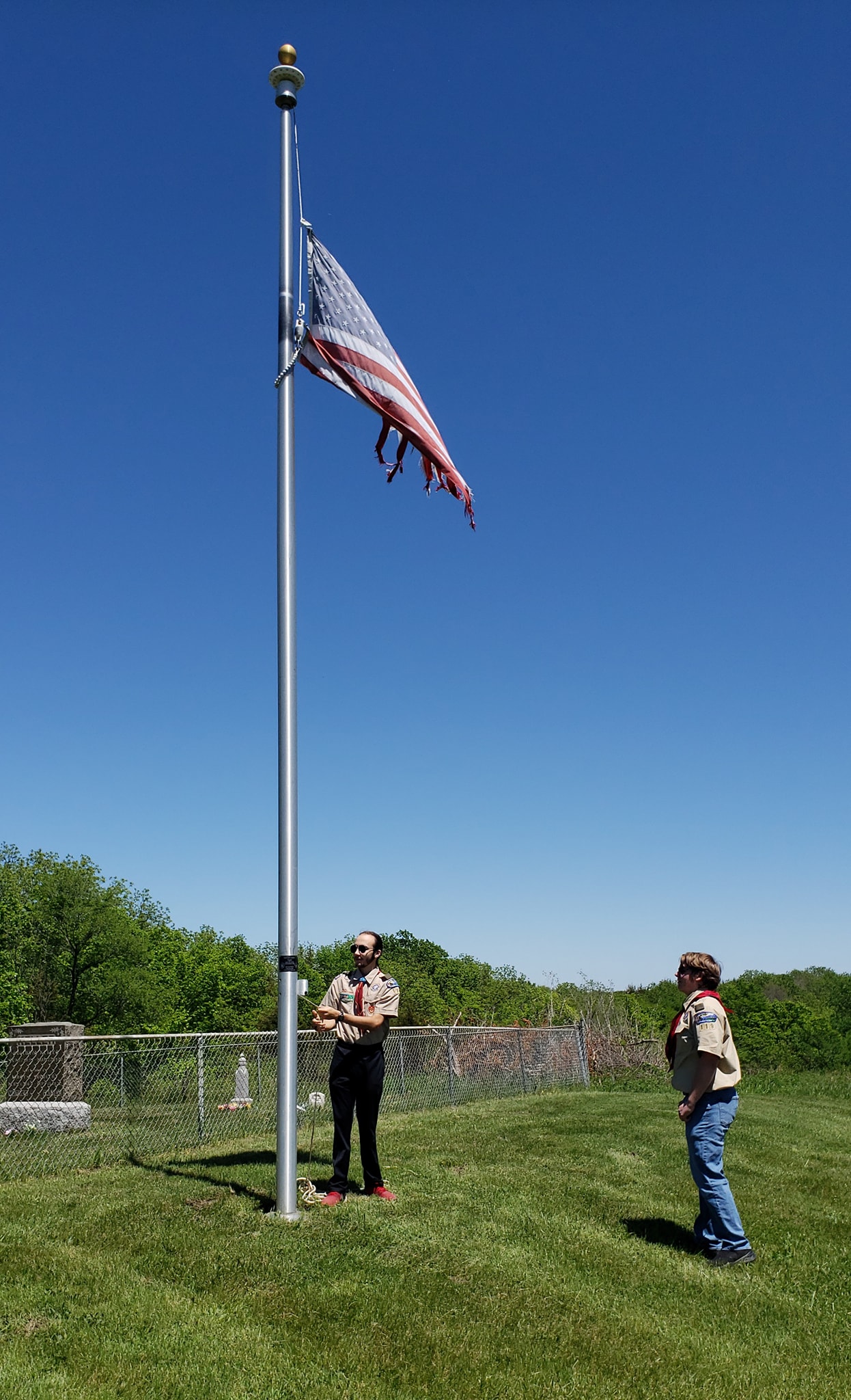 Lowering the old flag at Mt Tabor Cemetery.  Photo courtesy of: Kimberly Smith